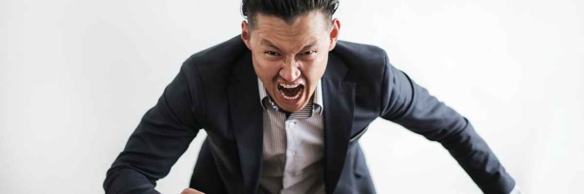 mad formal executive man yelling at camera