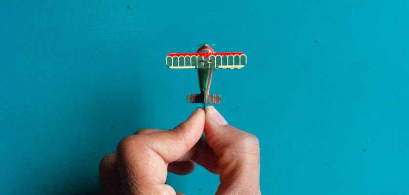 green and red monoplane toy